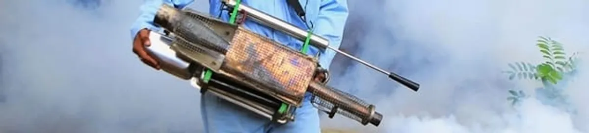Fumigation technician using a fogger for deep pest treatment in Charleston, SC